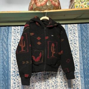 Wranglers all over a Sherpa jacket